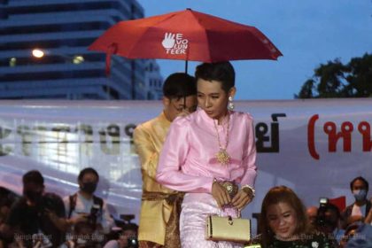 Jatuporn Sae Ung, 25, dressed to emulate the Queen during a demonstration in the Silom area of Bangkok