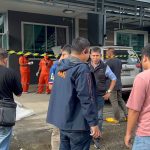 Police examine the crime scene after retired army officer kills his neighbour - Police Image