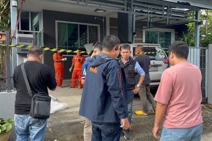 Police examine the crime scene after retired army officer kills his neighbour - Police Image