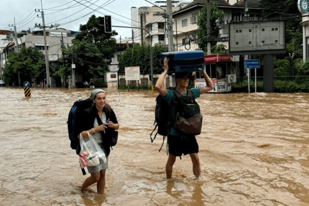 Tourists Wade through flood waters in Chiang Mai City