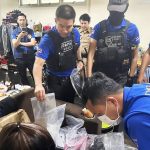 Authorities conduct a raid on a house in Lak Si district of Bangkok - Police Image