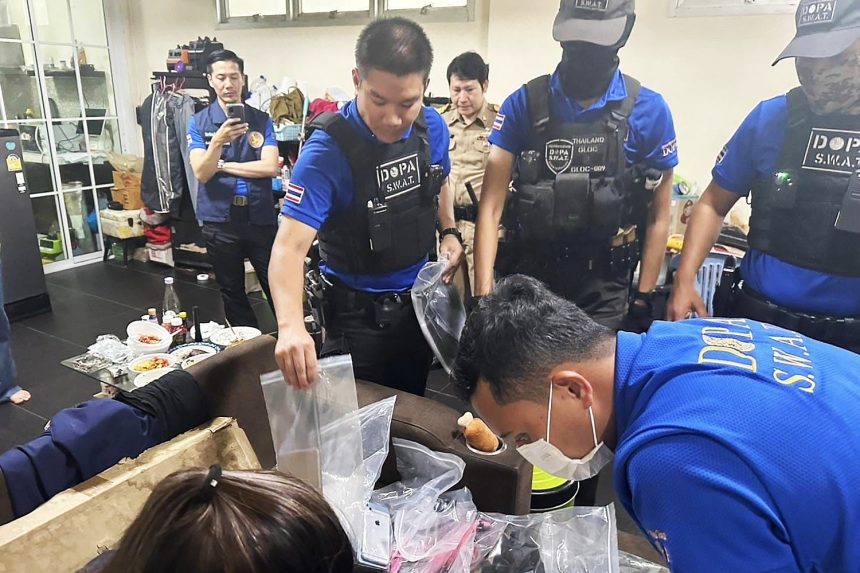 Authorities conduct a raid on a house in Lak Si district of Bangkok - Police Image