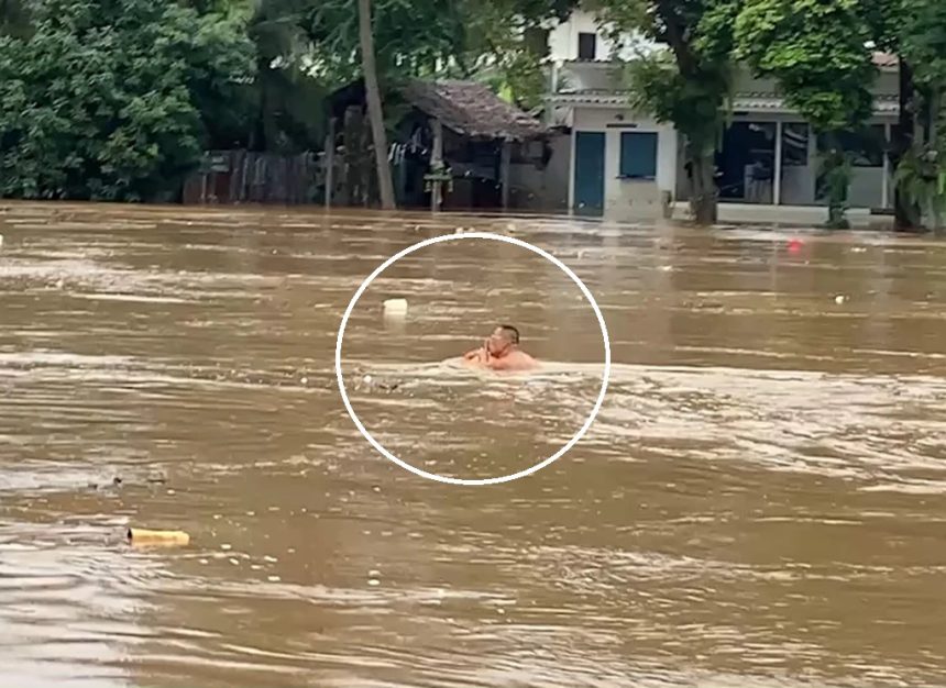 Chinese man swims in the Ping River, Chiang Mai