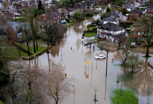 A drone view shows abandoned cars after heavy overnight rain caused roads to flood, leaving cars stranded in Manchester