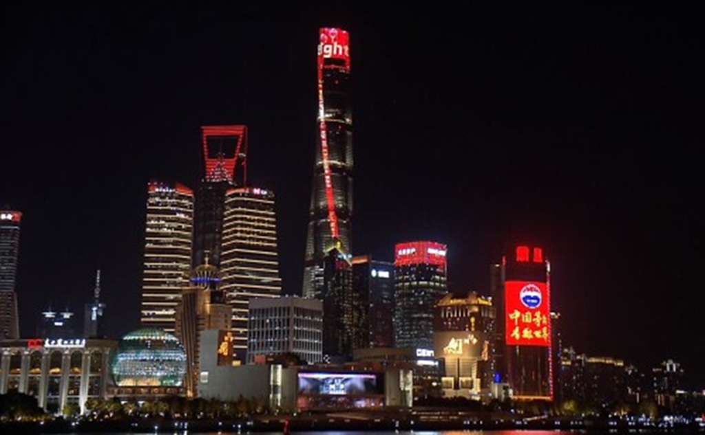 Shanghai Tower lights up in red in the evening on January 28, 2025.